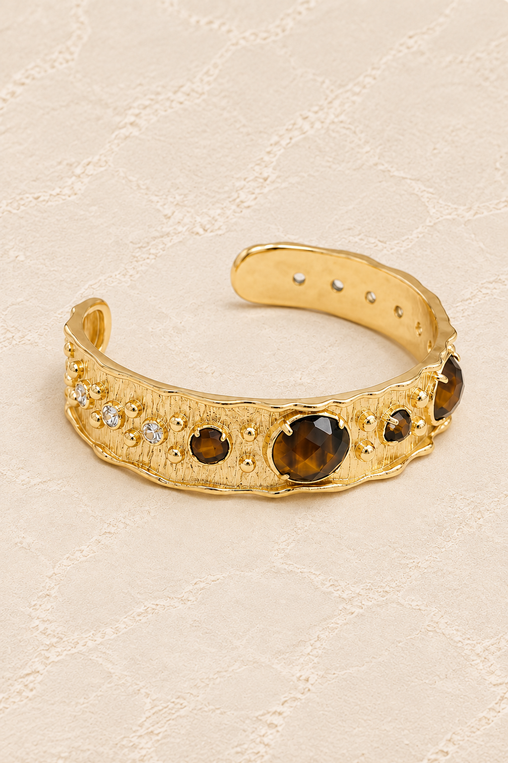 Tiger’s Eye Solara Cuff Bracelet on ivory plaster, tall product cover