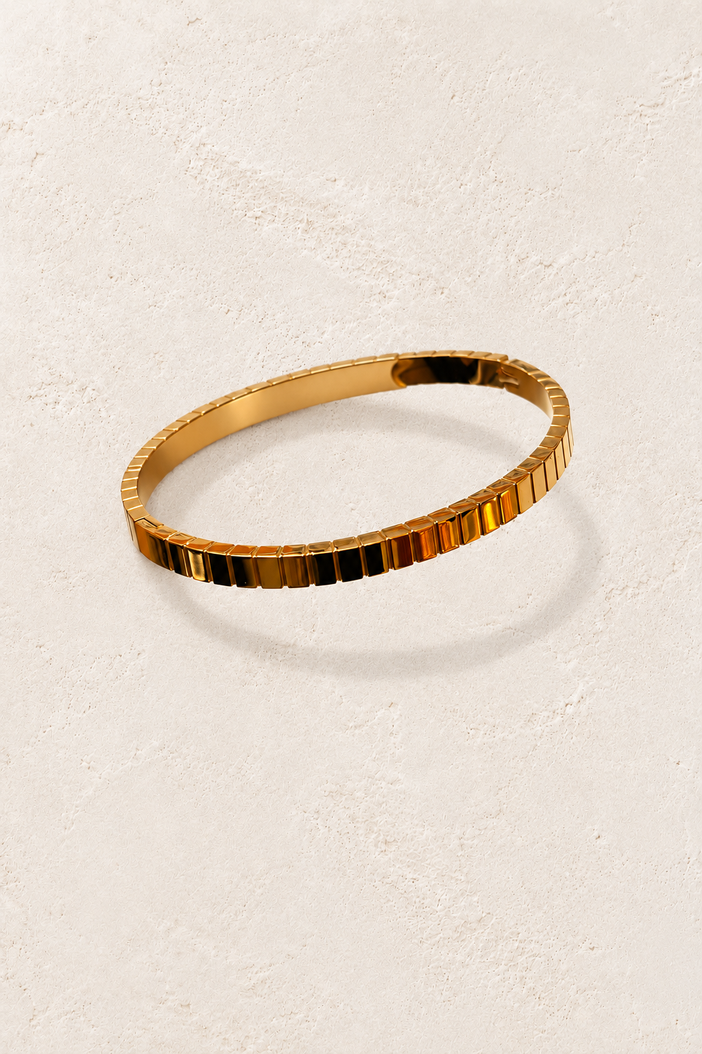 
                  
                    Brisa Max Gold Ribbed Bangle on cream beige textured background
                  
                