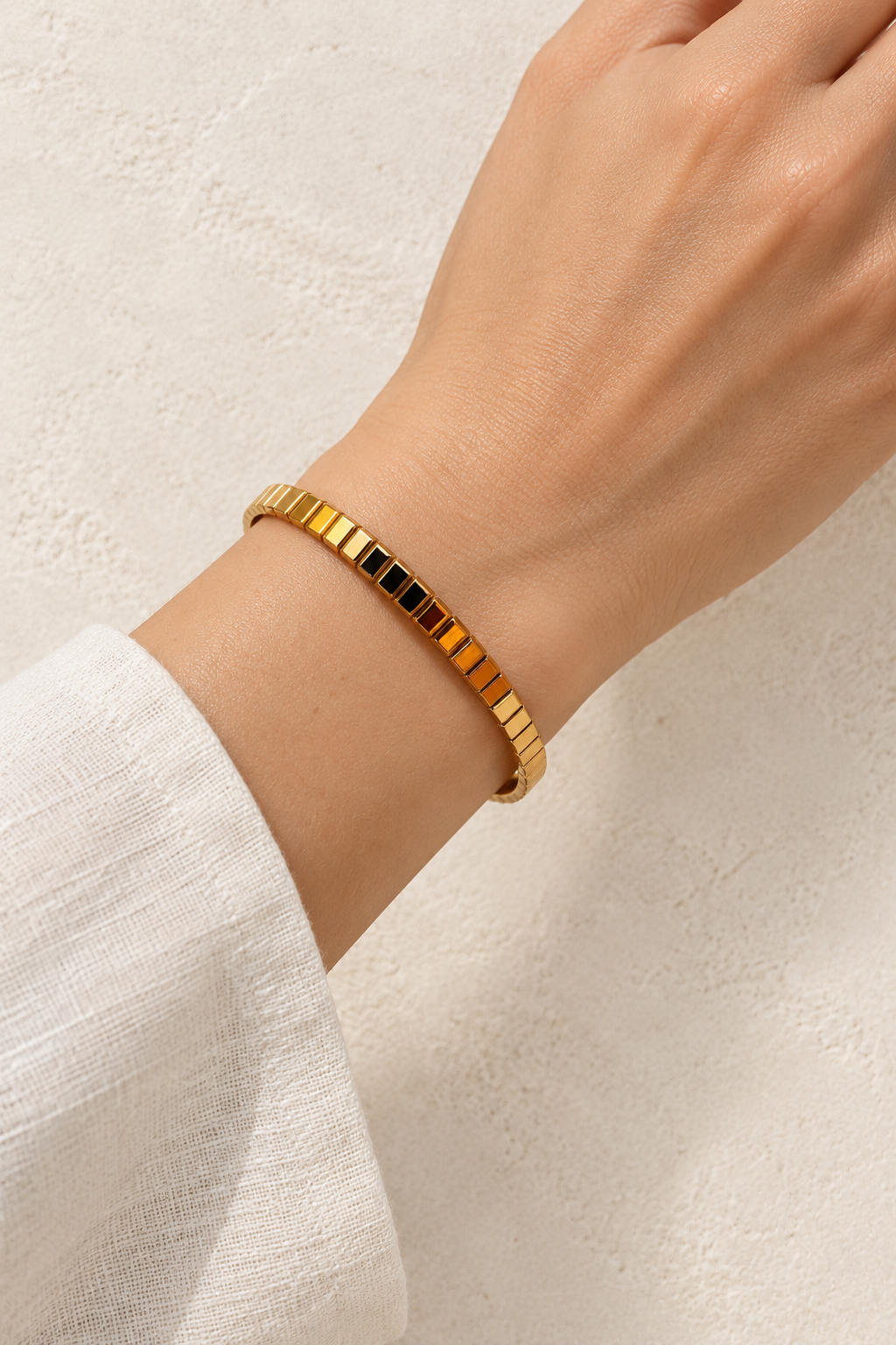 
                  
                    Model wearing Brisa Max Gold Ribbed Bangle
                  
                