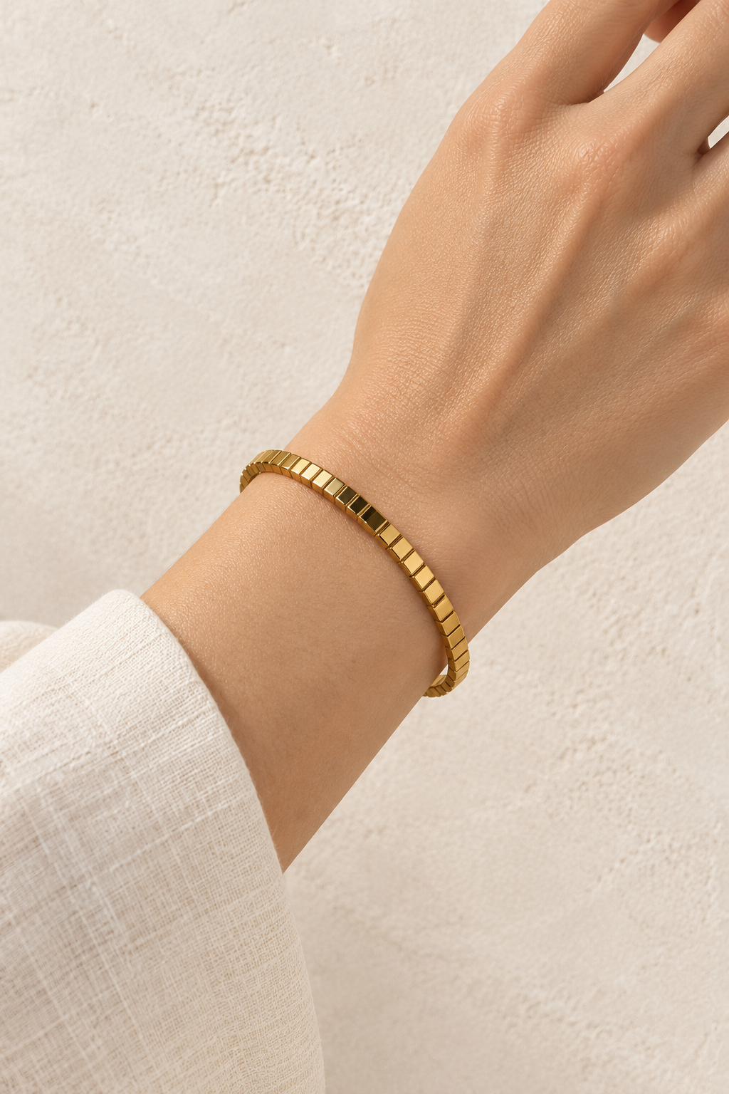 
                  
                    Model wearing Brisa Mini Gold Ribbed Bangle
                  
                