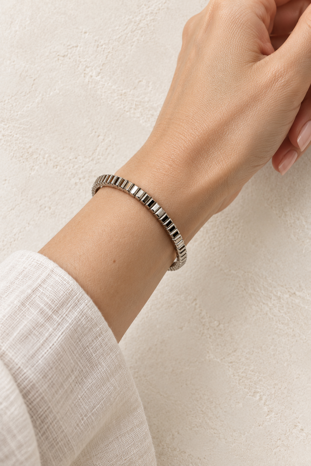 
                  
                    Model wearing Brisa Mini Silver Ribbed Bangle
                  
                
