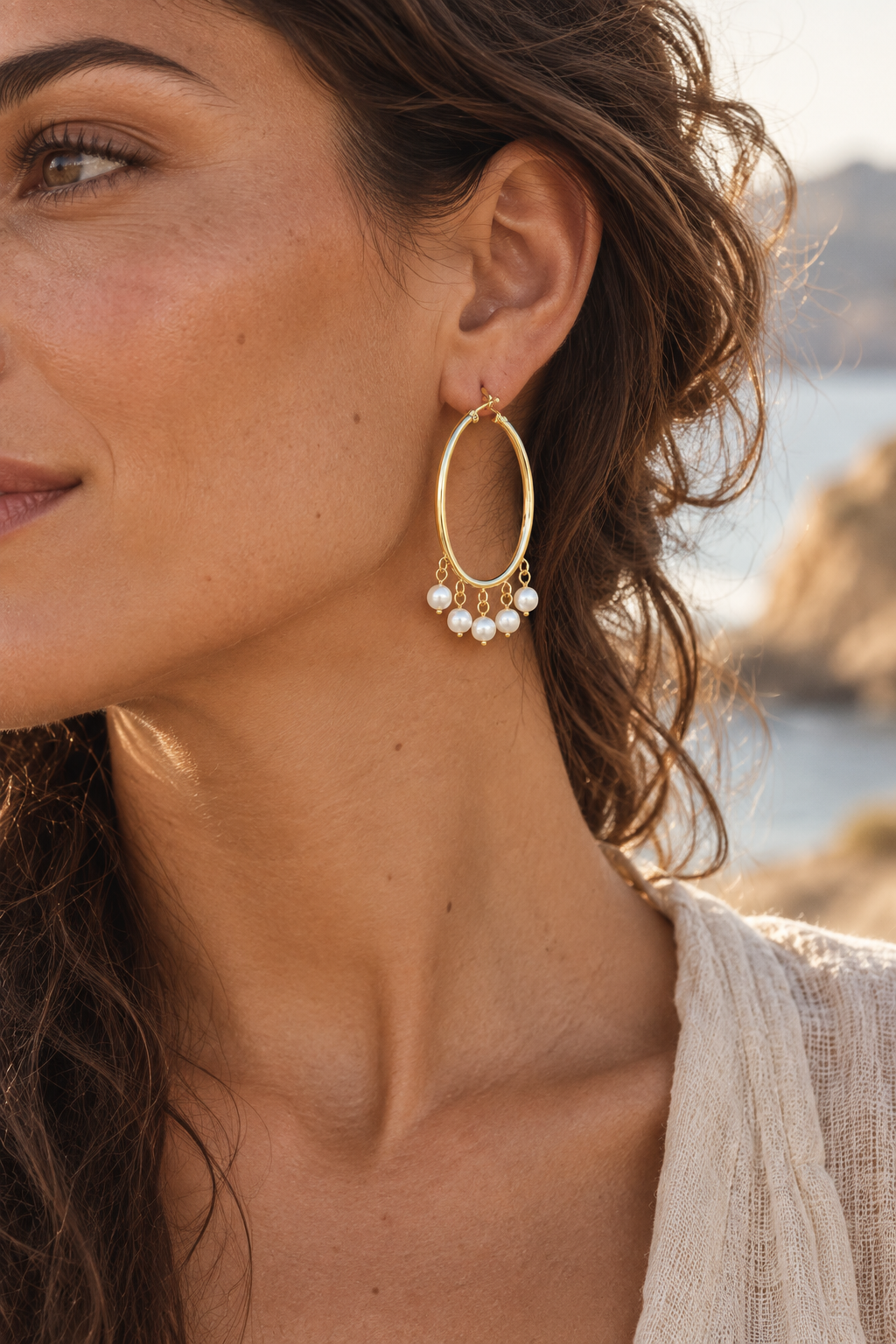 Boho model wearing Cascada Gold Pearl Hoops