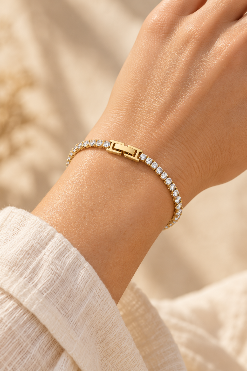 Celeste Classic Gold Tennis Bracelet worn on a model's wrist