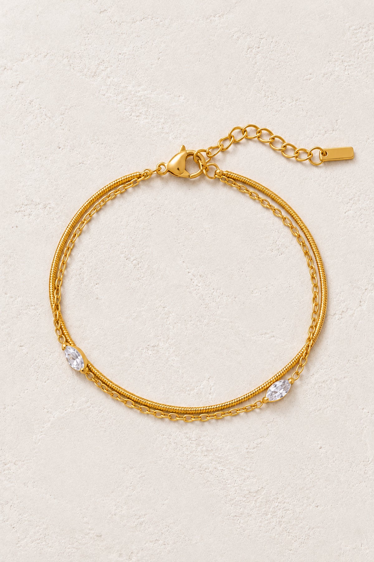 Celeste Gold Crystal Layered Bracelet on Boho & Mala's ivory plaster background