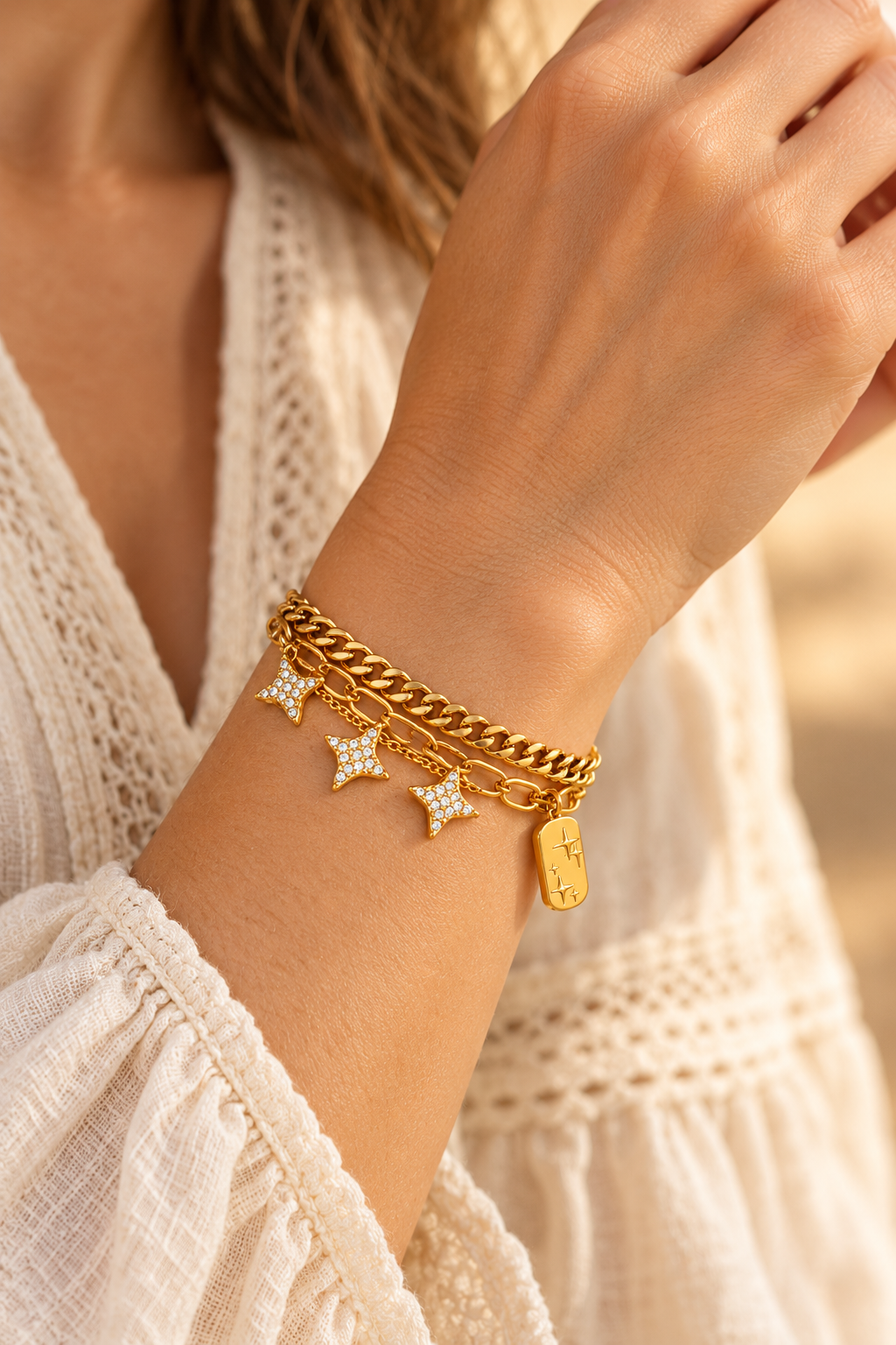 
                  
                    Zella Gold Star Layered Charm Bracelet worn on a model's wrist
                  
                