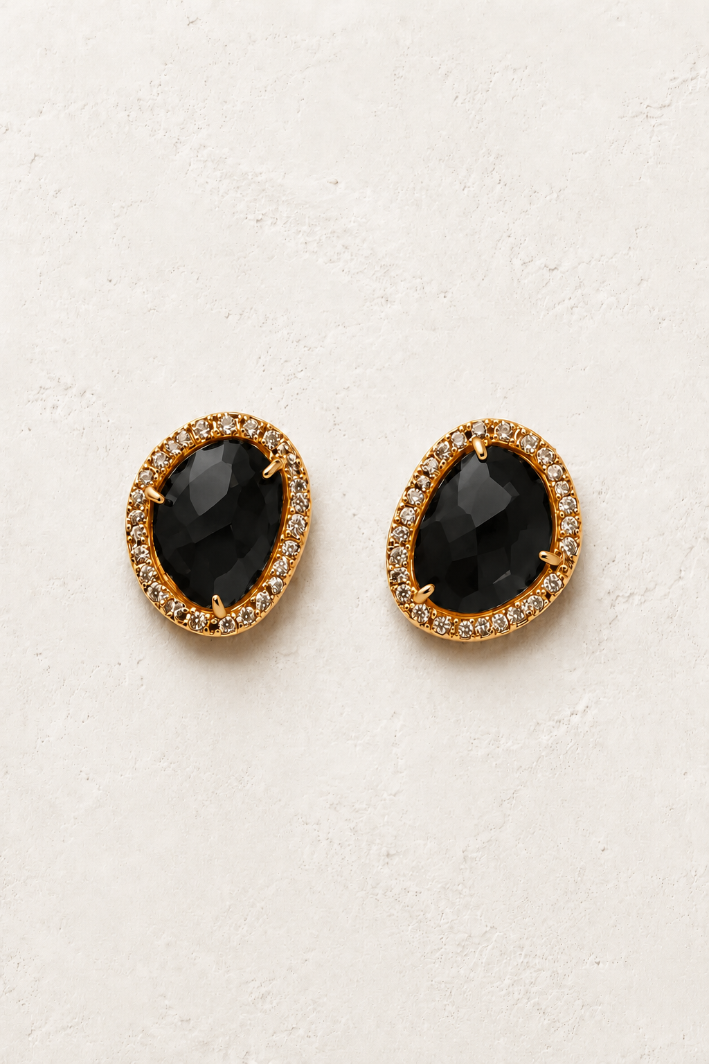 Celestine Black Obsidian genuine gemstone stud earrings on cream textured background