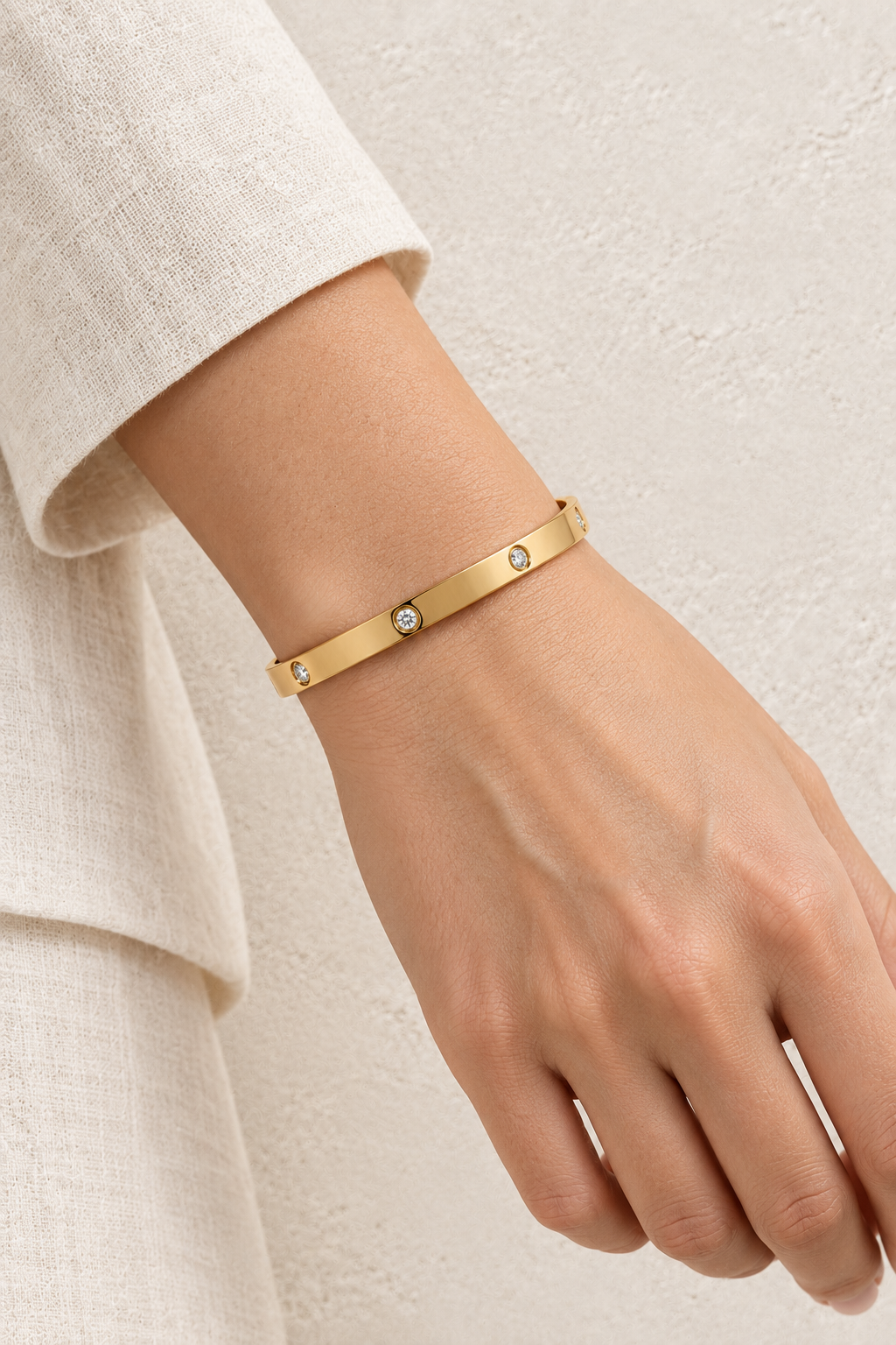 Model wearing Celine Gold Scattered Crystal Bangle