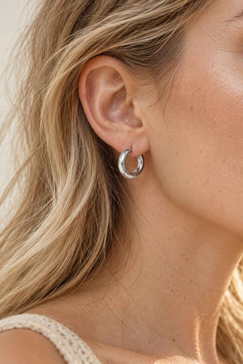 
                  
                    Model wearing Classic Waterproof Hoop Earrings – Silver 14mm
                  
                