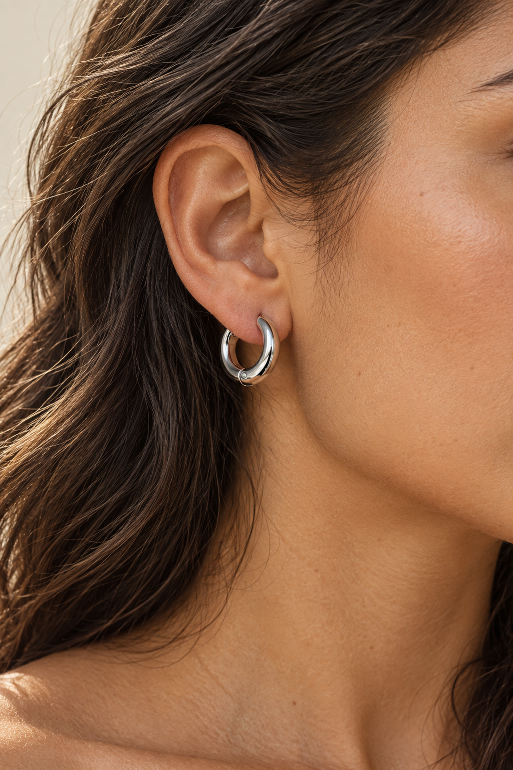 
                  
                    Model wearing Classic Waterproof Hoop Earrings – Silver 9mm
                  
                