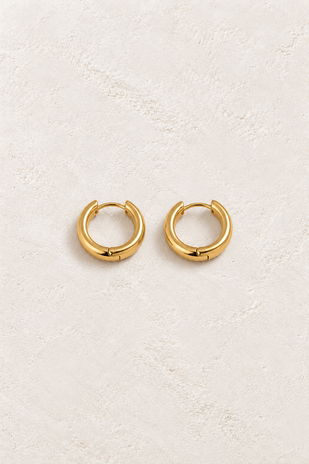 
                  
                    Classic Waterproof Hoop Earrings Gold 7mm on cream textured background
                  
                