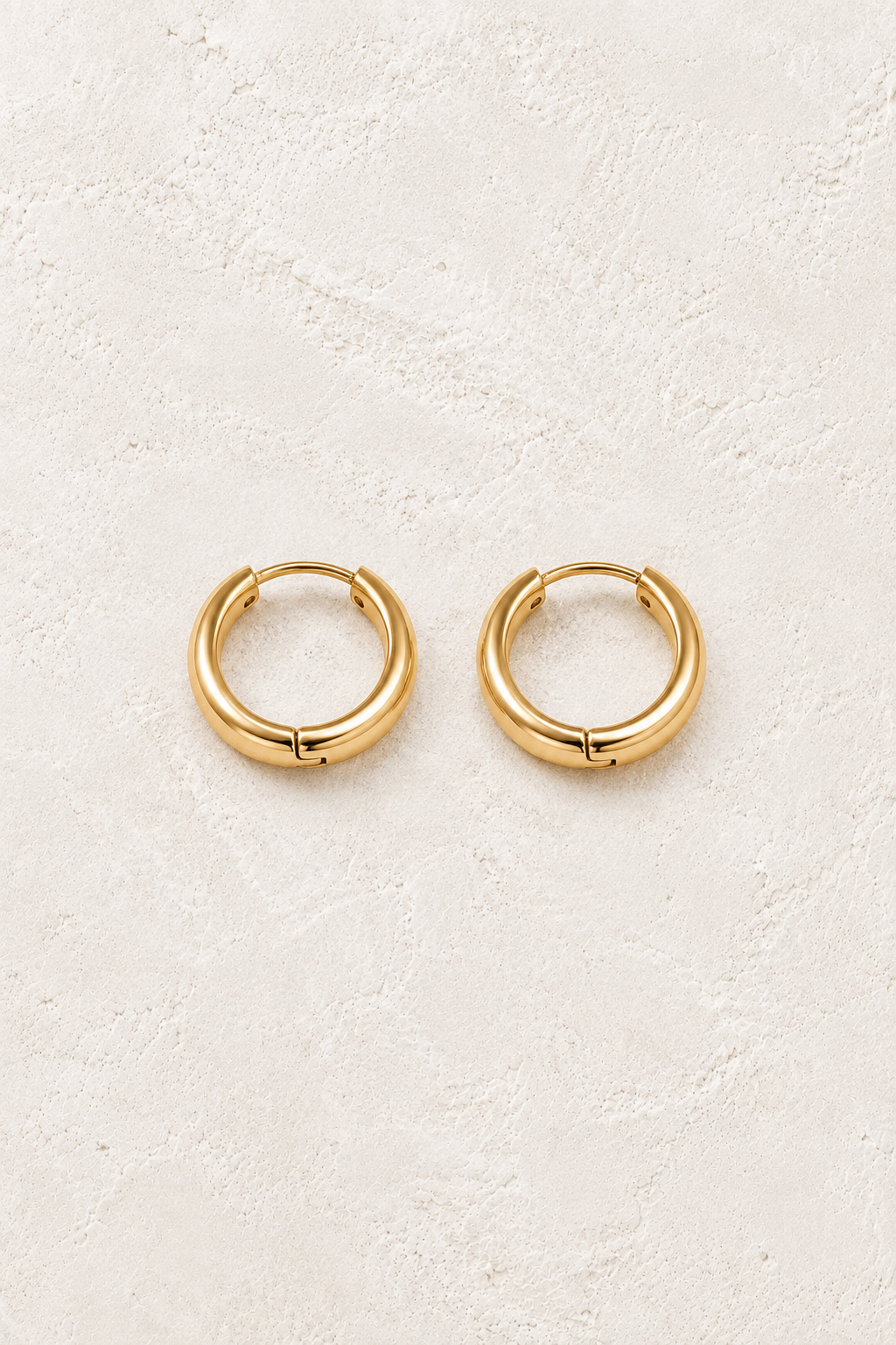 
                  
                    Classic Waterproof Hoop Earrings Gold 9mm on cream textured background
                  
                