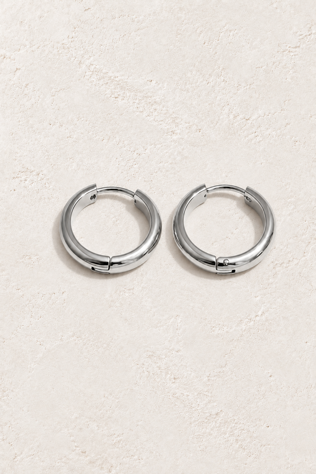 Classic Waterproof Hoop Earrings – Silver 14mm on Boho & Mala textured background