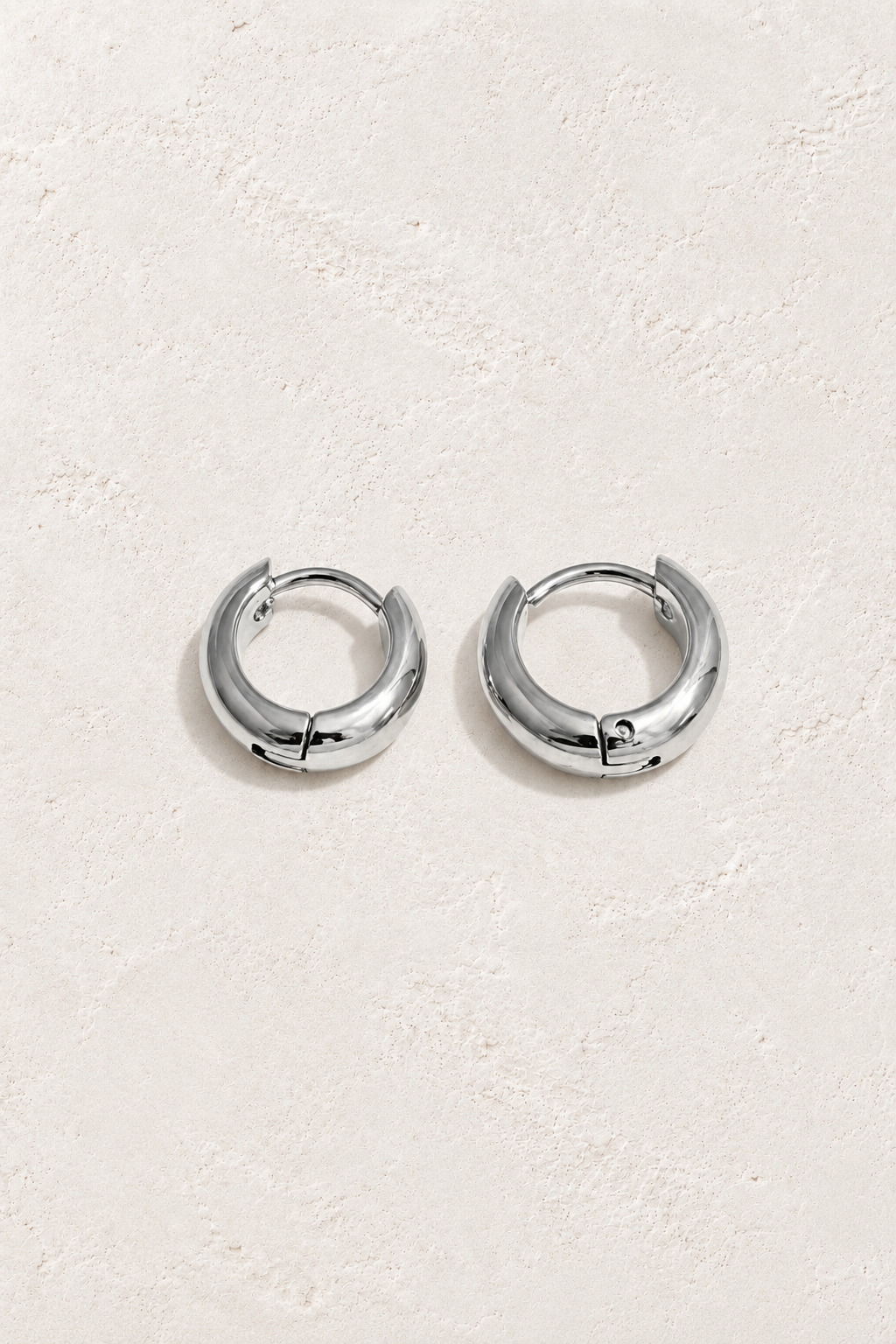 Classic Waterproof Hoop Earrings – Silver 7mm on Boho & Mala textured background