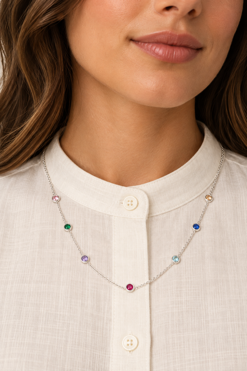 Colourful Pendant Silver Necklace with seven coloured bezel-set stones worn on a model