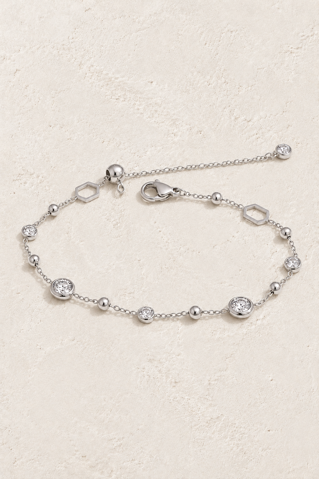 Silver Crystal & Hexagon Bracelet on approved cream hero background