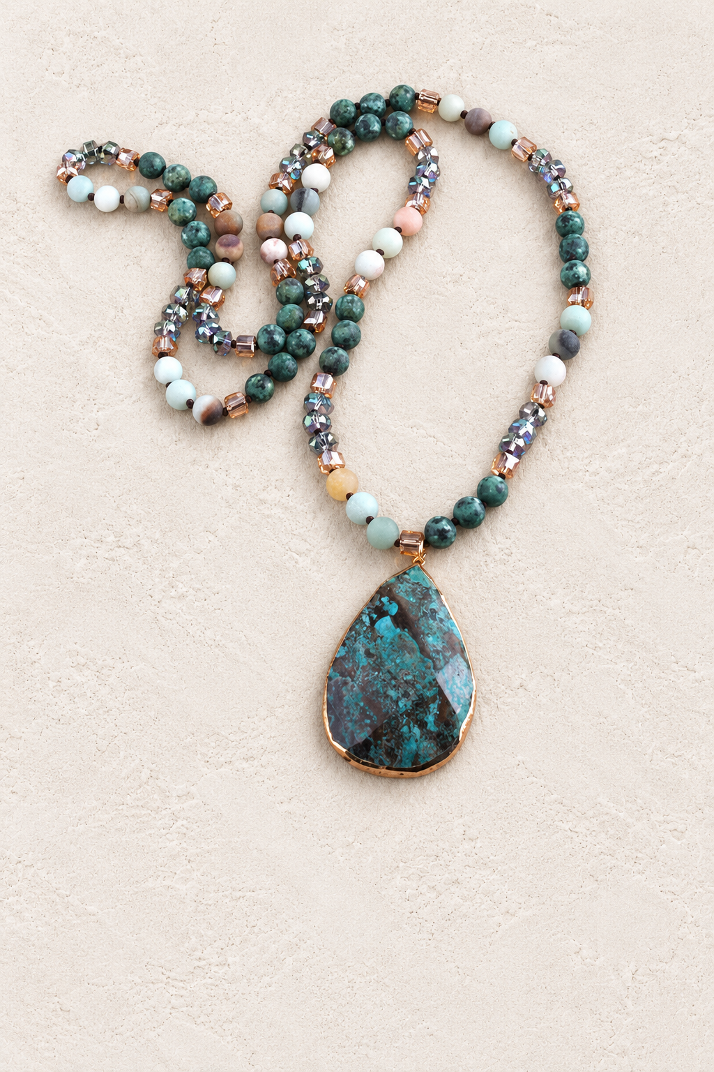 Dark Mixed Stone Tribal Necklace on warm cream plaster background