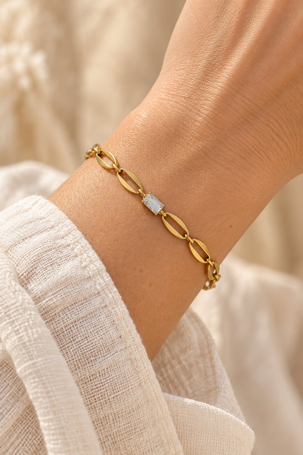 
                  
                    Delphine Gold Crystal Centre Link Bracelet worn on a model's wrist
                  
                
