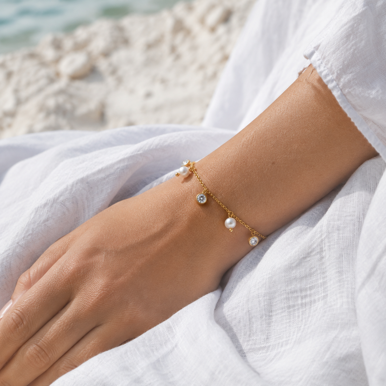 
                  
                    Delphine freshwater pearl drop bracelet on boho model
                  
                