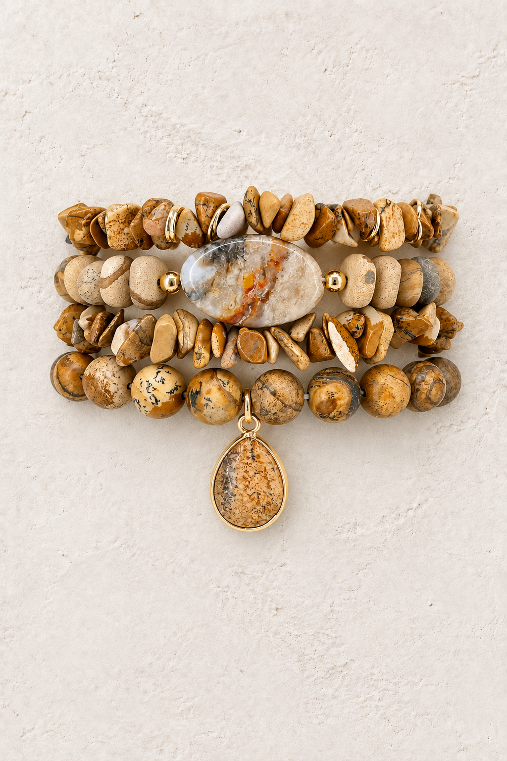 Desert Wanderer 4-piece elastic bracelet stack on warm textured background