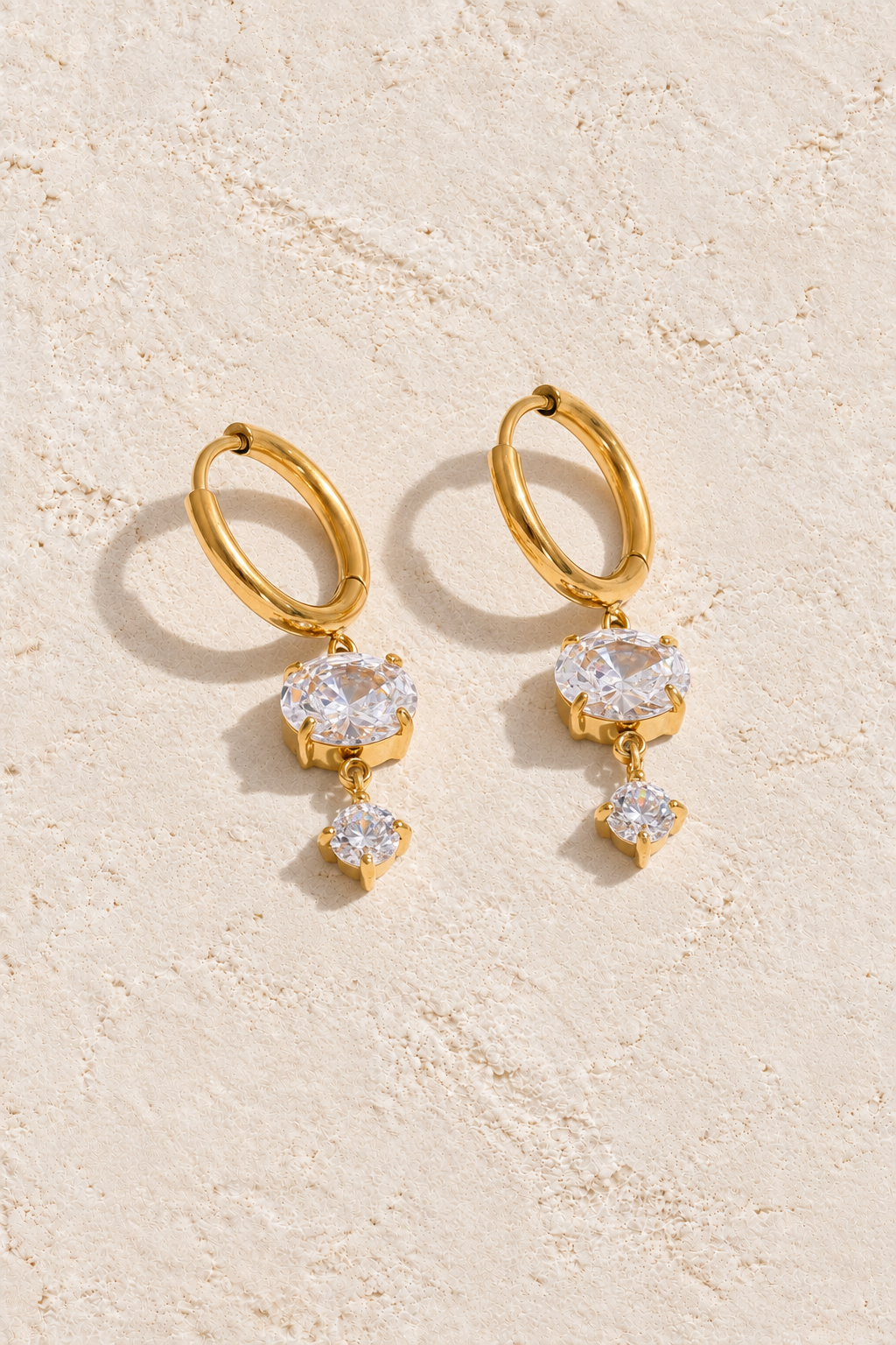 Gold Double Round Crystal Drop Hoop Earrings on cream plaster