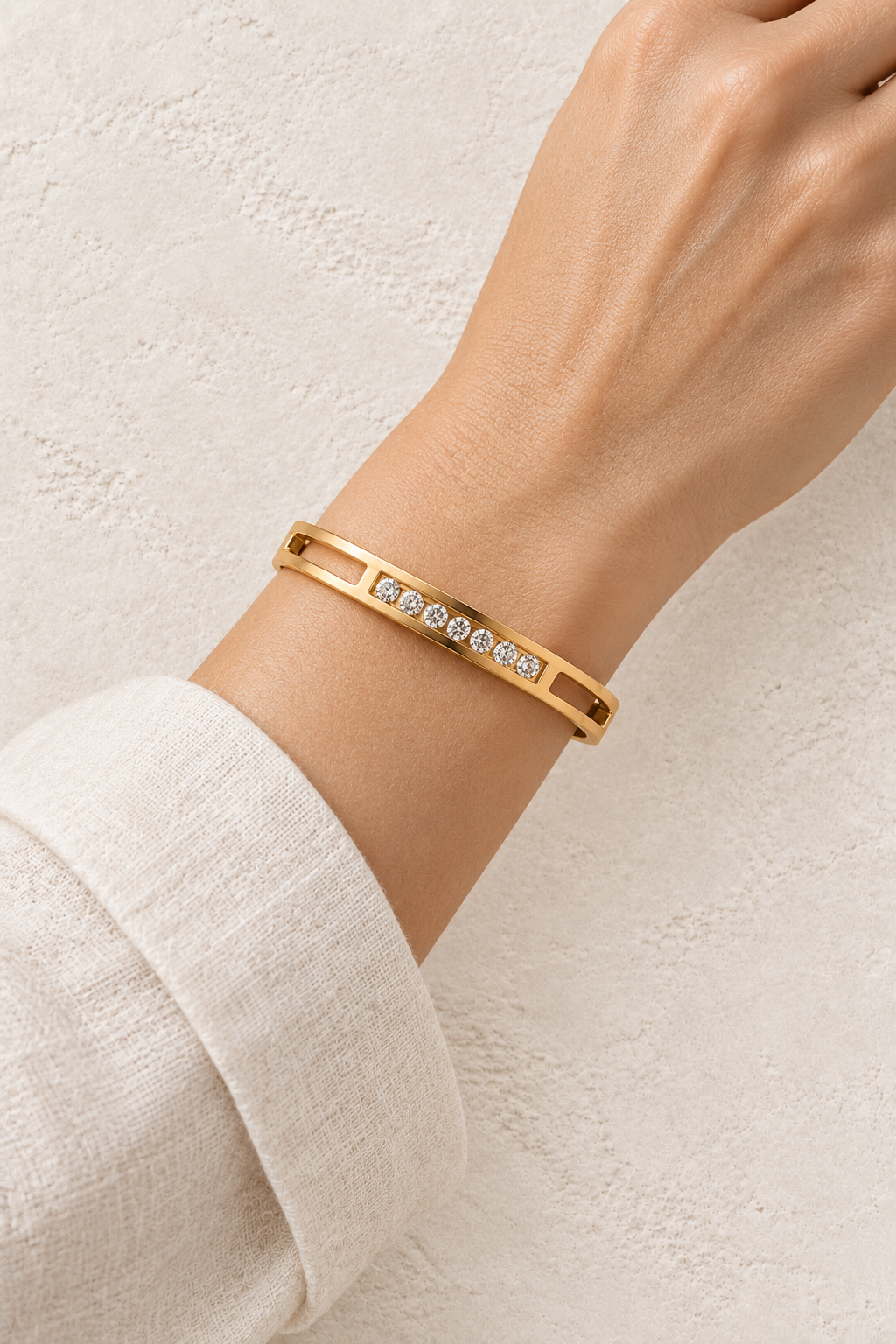 
                  
                    Model wearing Elira Gold Double Row Crystal Bangle
                  
                