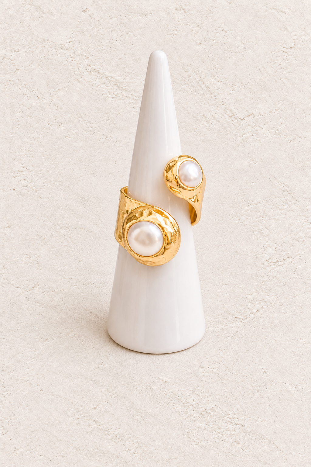 Elowara Freshwater Pearl Ring (Adjustable) on white cone against warm textured background