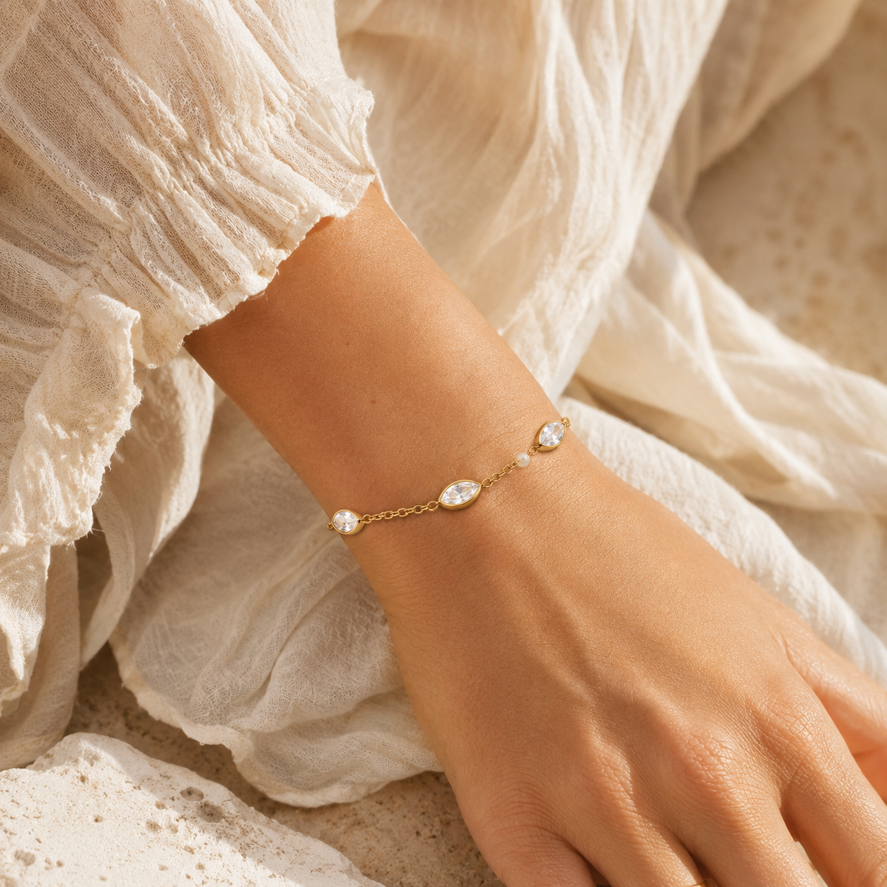
                  
                    Elowen marquise crystal bracelet worn on boho model
                  
                