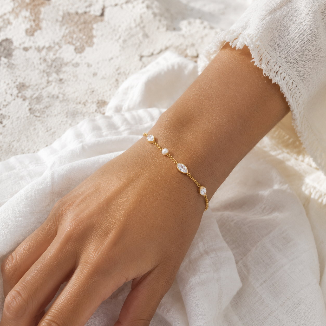 
                  
                    Elowen crystal and freshwater pearl bracelet on boho model
                  
                