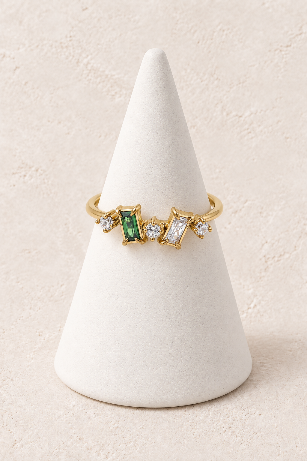 Emerald Glow Ring on Boho & Mala warm ivory textured background