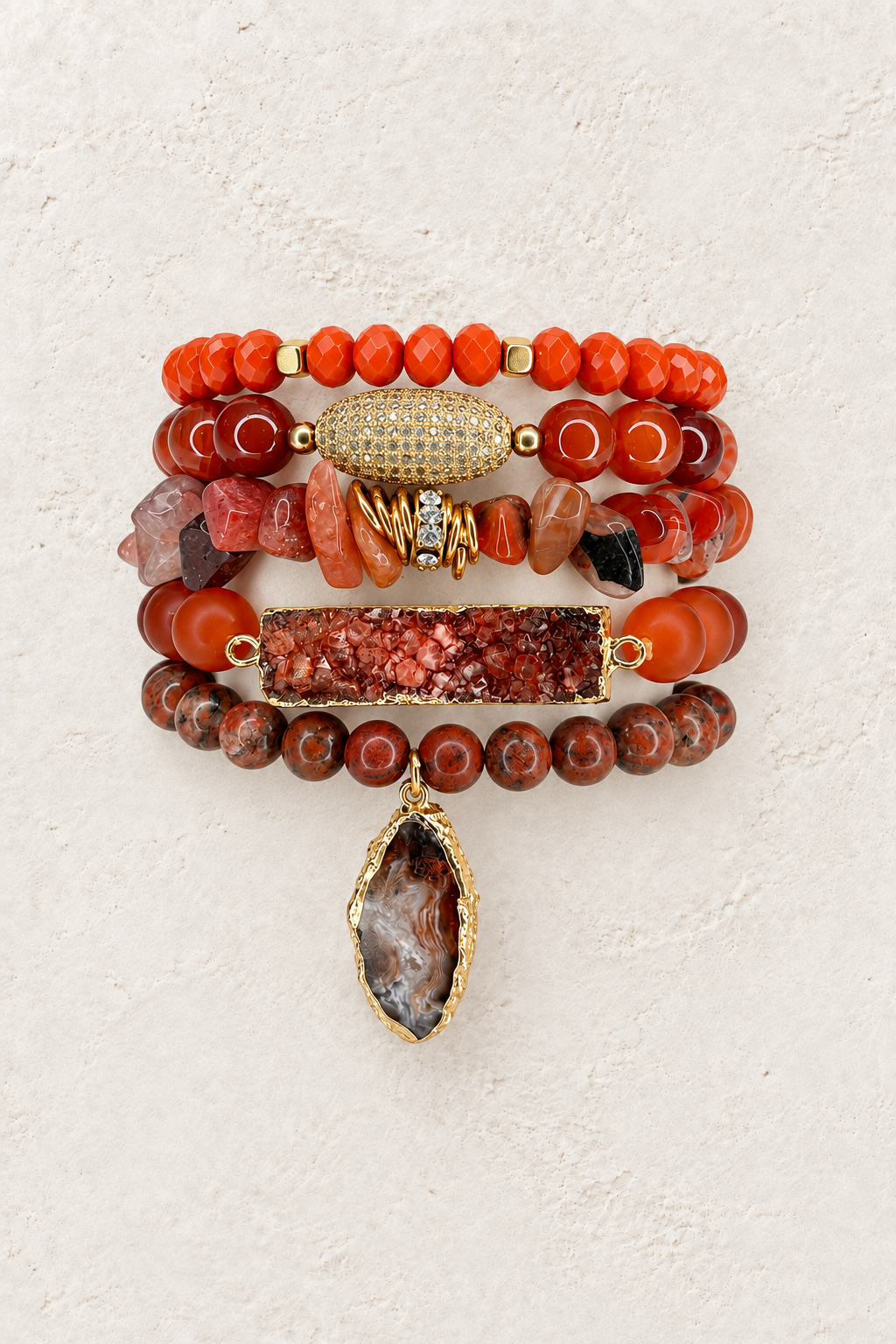 Firelight 5-piece elastic bracelet stack on warm textured background