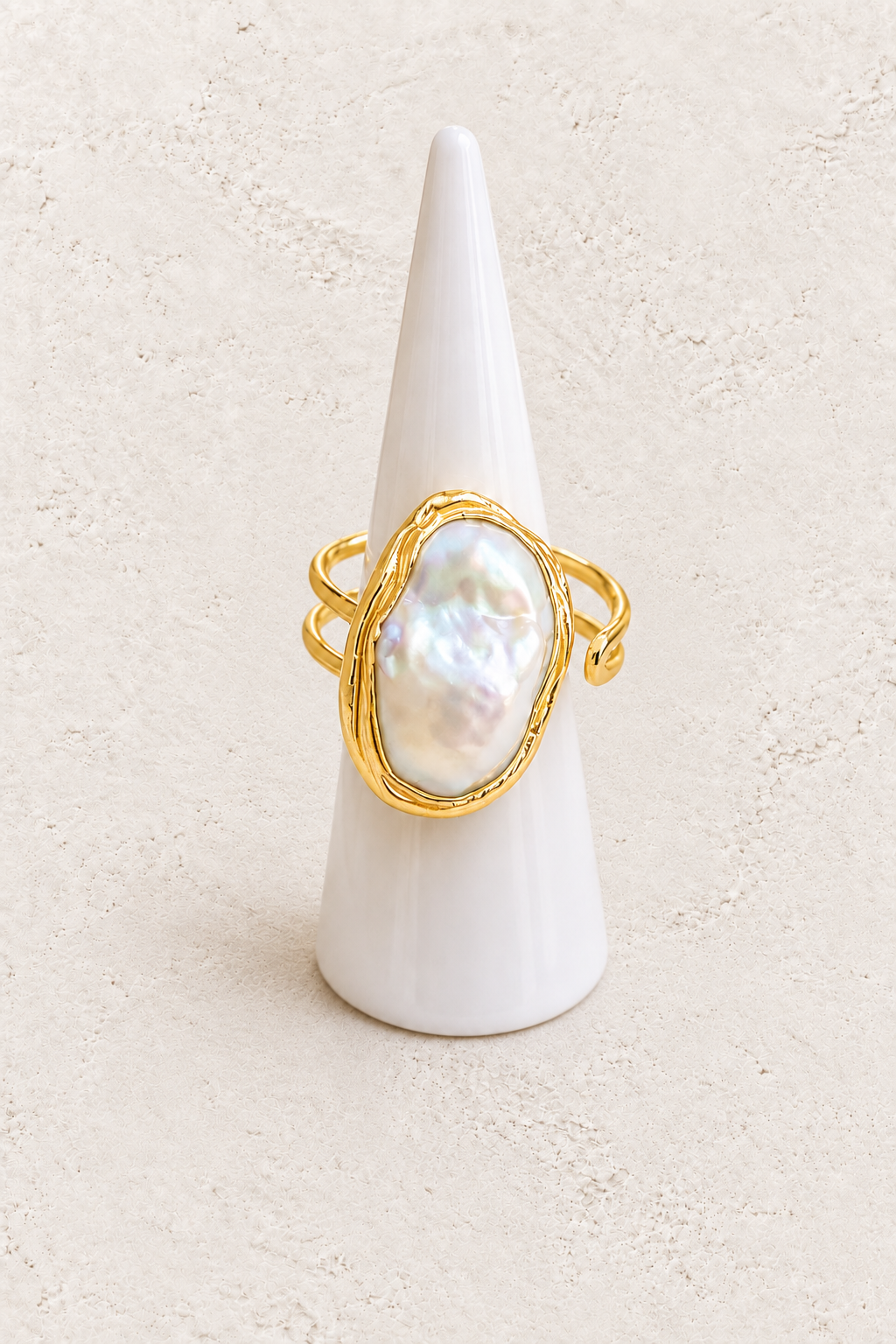 Avenelle Freshwater Pearl Ring (Adjustable) on white cone against warm textured background