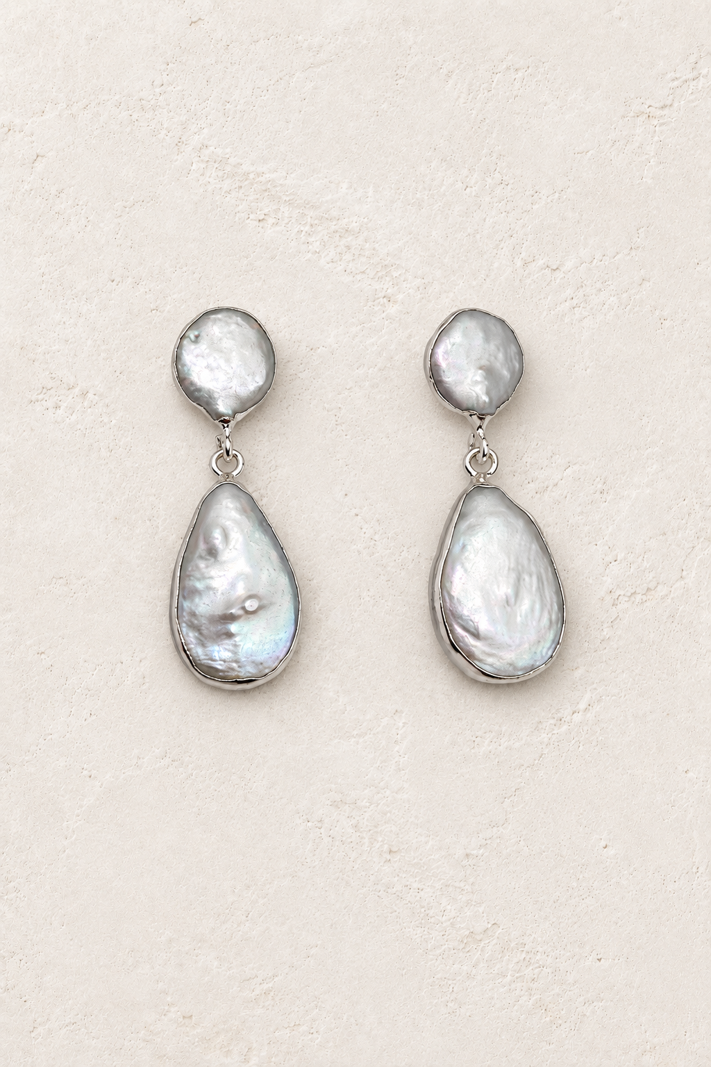 Freshwater Silver Drop Earrings on cream textured background