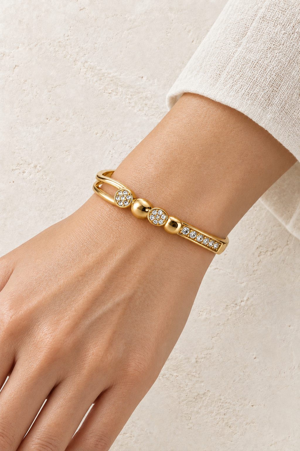
                  
                    Model wearing Gold Crystal Disc Detail Bangle | Waterproof
                  
                