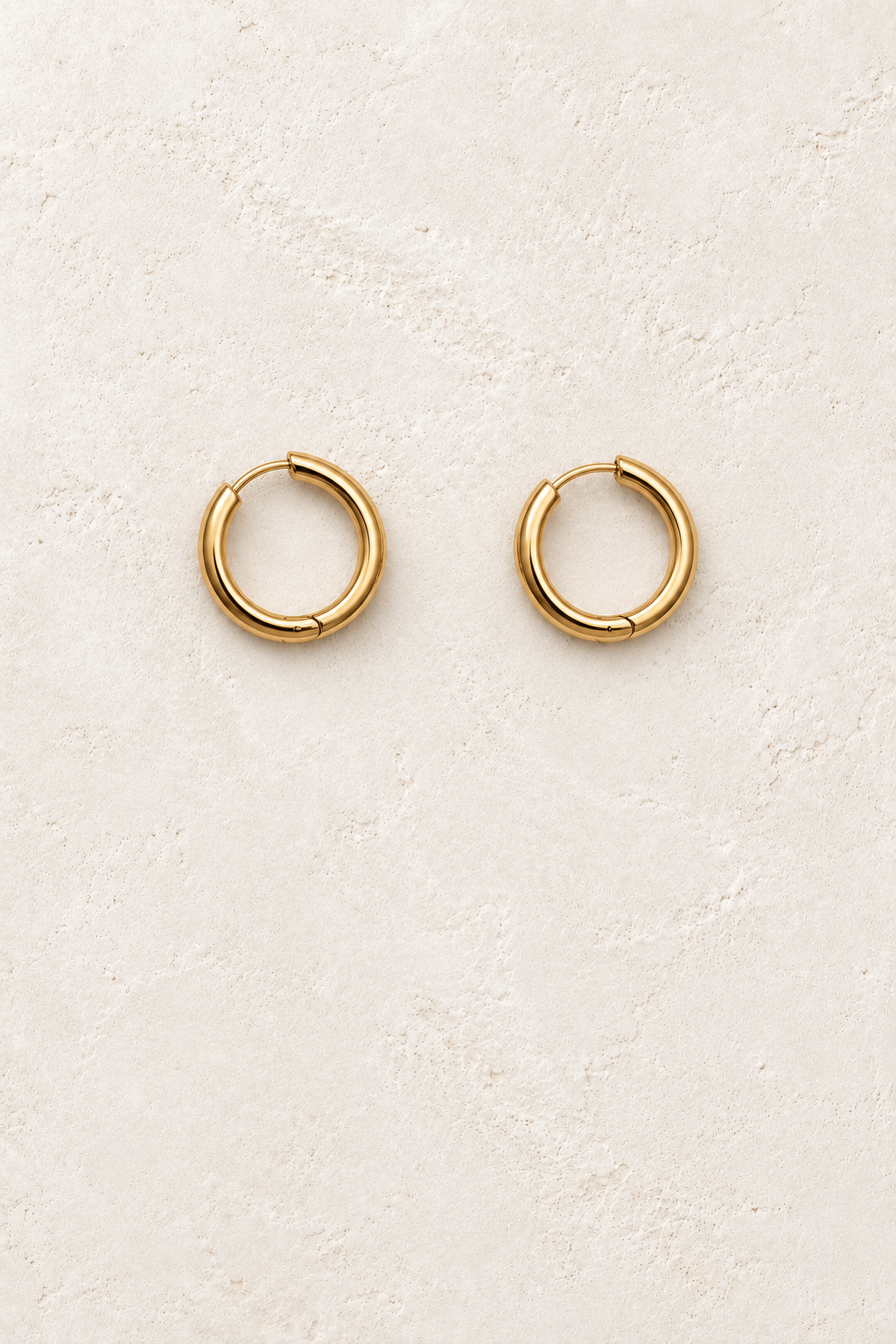 
                  
                    Gold 12mm – Slim Classic Waterproof Hoop Earrings on cream plaster background
                  
                