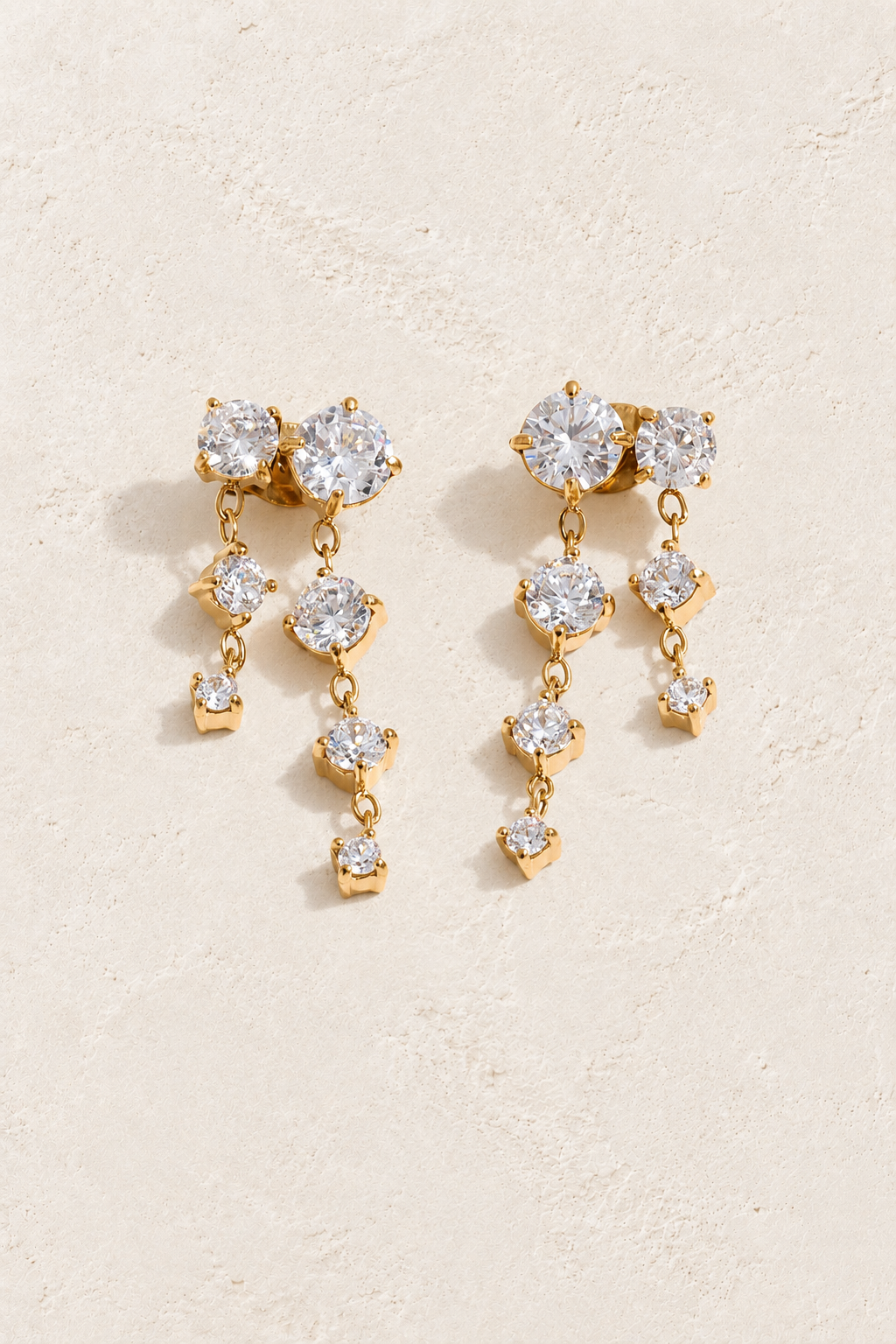 Gold Clear Crystal Twin Cascade Earrings — original cream plaster hero