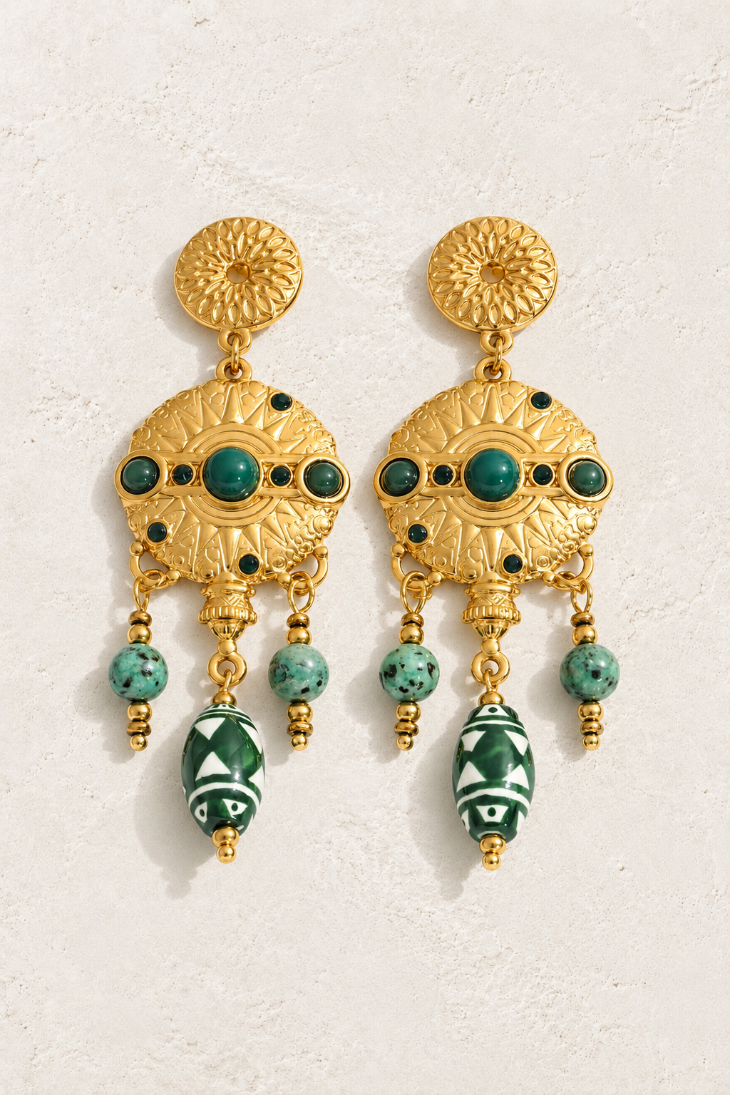 
                  
                    Gold Green Stone & Ceramic Medallion Earrings — original cream plaster hero
                  
                