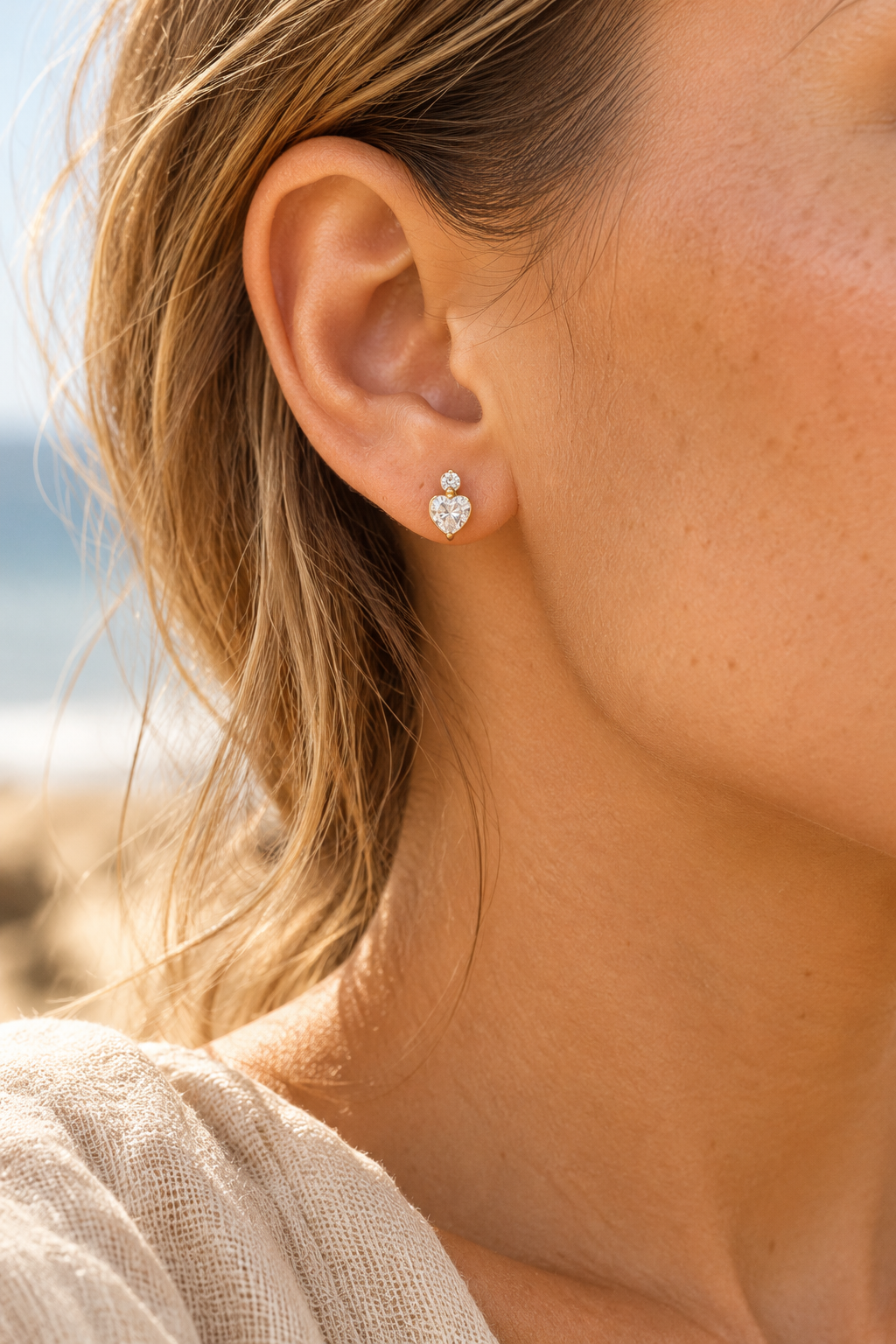 gold 10mm cubic zirconia heart studs worn on model