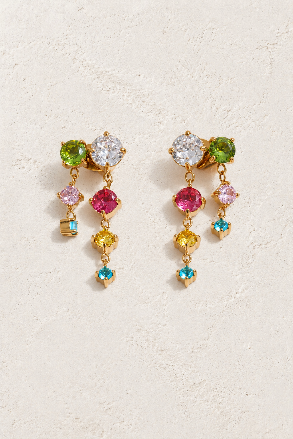 
                  
                    Gold Multicolour Crystal Twin Cascade Earrings — original cream plaster hero
                  
                