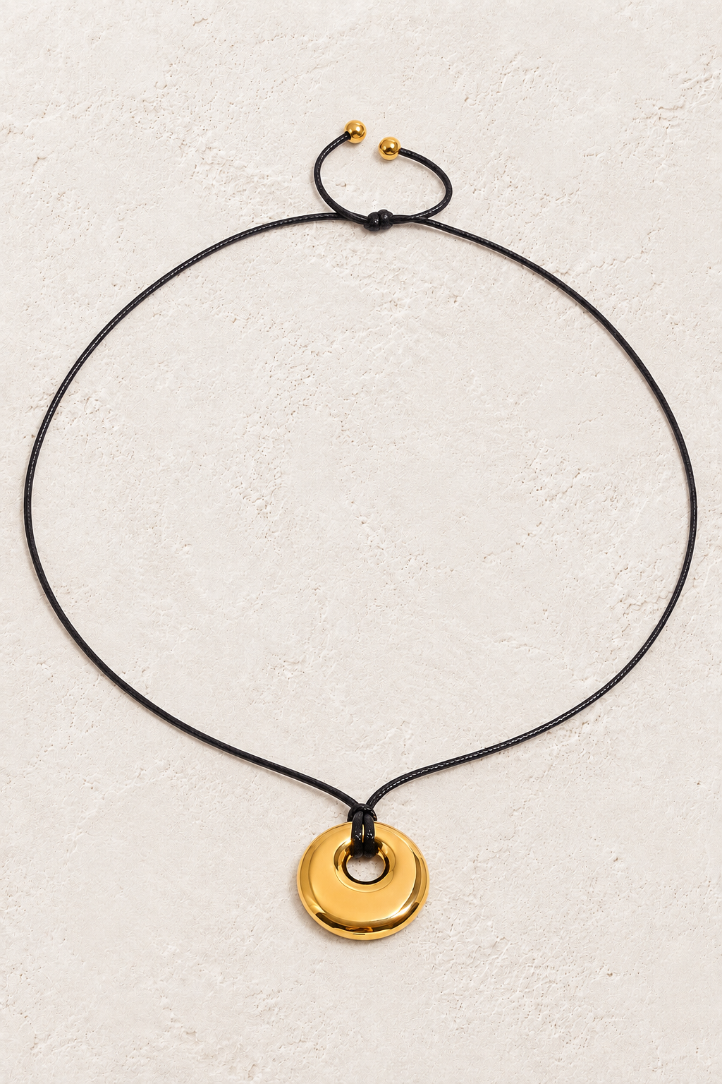 Gold necklace with black cord and circular pendant – Boho & Mala gold necklace
