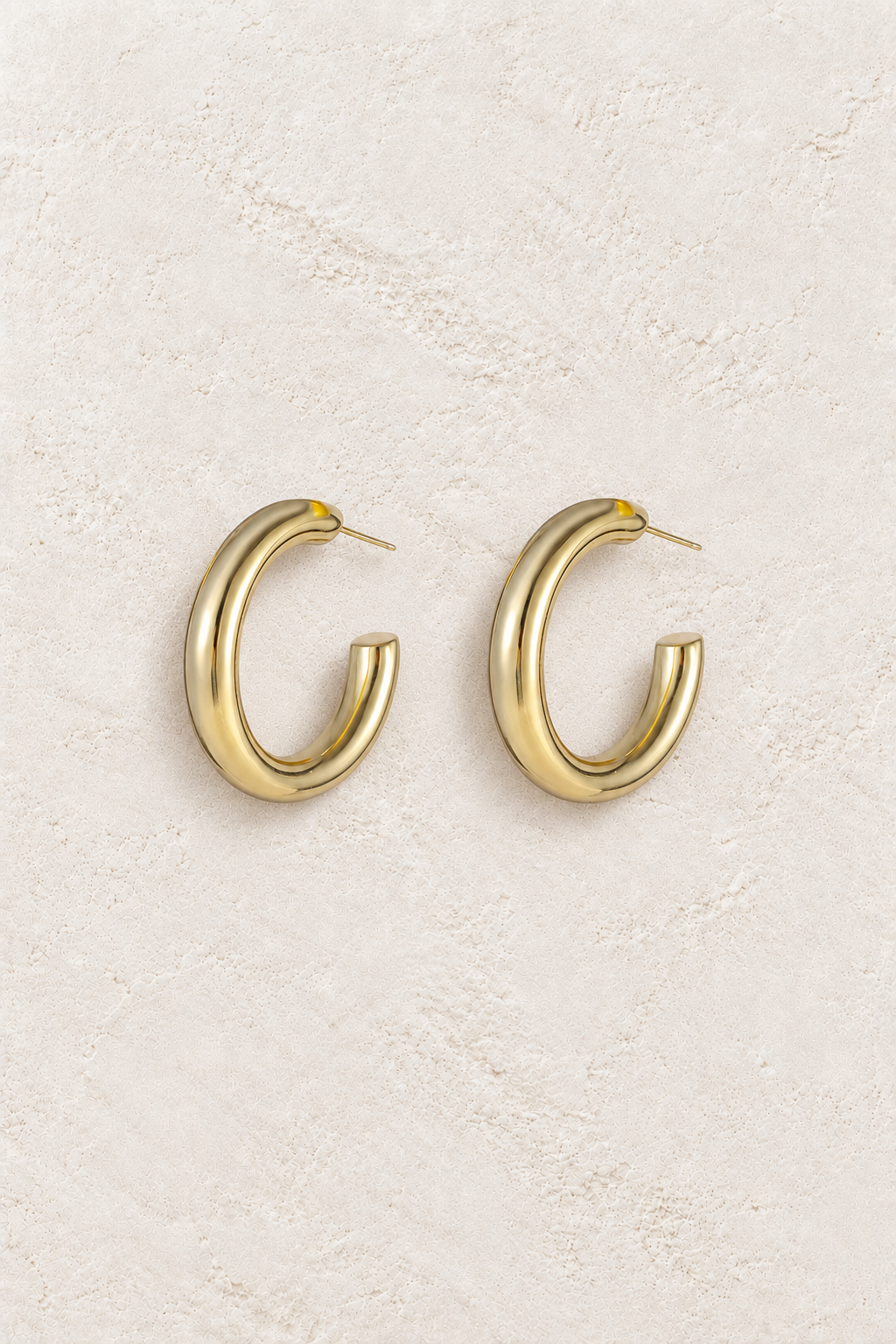 Gold Plated Sterling Silver Dainty Minimalist Hypoallergenic Hoop Earrings- Boho Jewellery For Wild Souls on warm ivory textured background