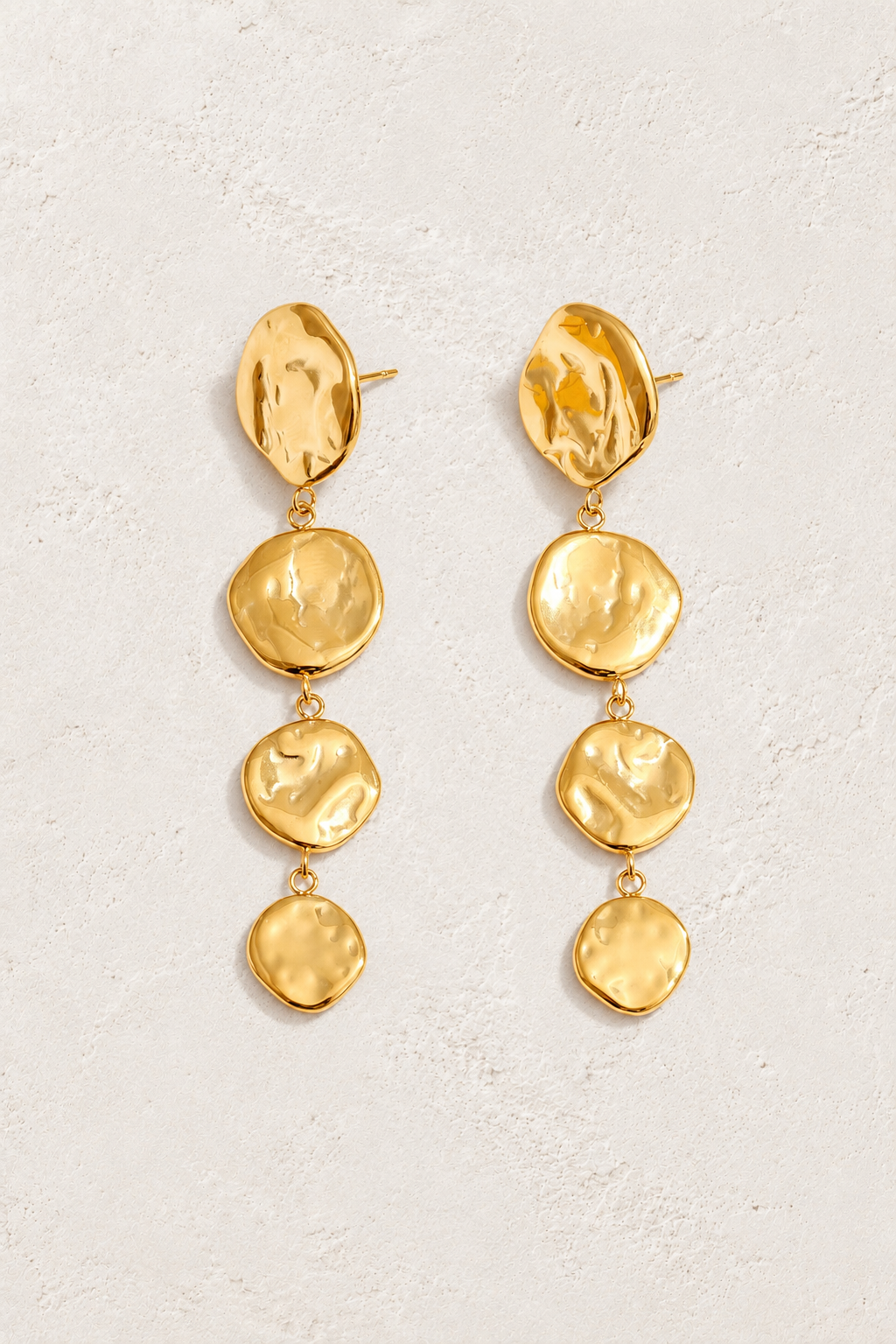 
                  
                    Gold Hammered Four Disc Drop Earrings — original cream plaster hero
                  
                