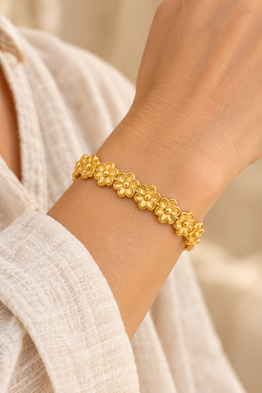 Golden Blossom Floral Link Gold Bracelet worn on a model's wrist