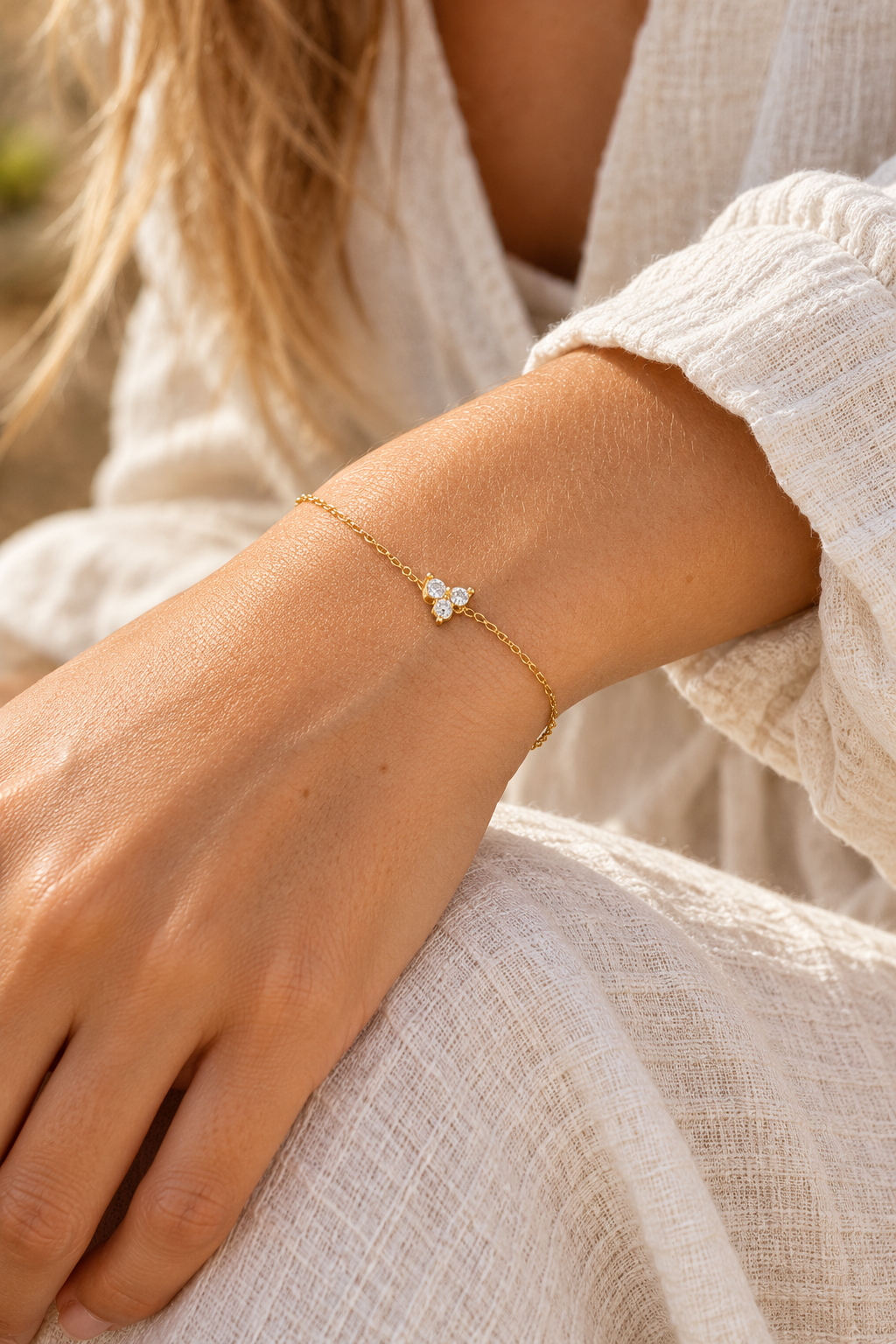 Gold crystal butterfly chain bracelet worn on a wrist