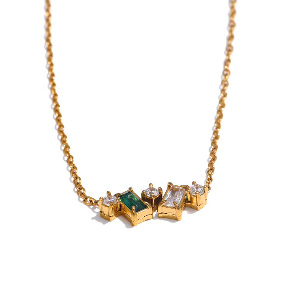 
                  
                    Gold necklace featuring green and clear zircon cluster
                  
                