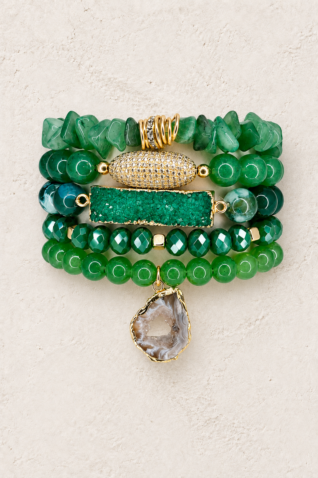 Green Jade 5-piece elastic bracelet stack on warm textured background