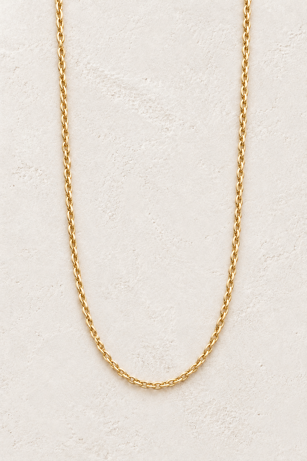 Isla Gold Thin Rope Chain Necklace TF on the Boho & Mala cream stone hero background