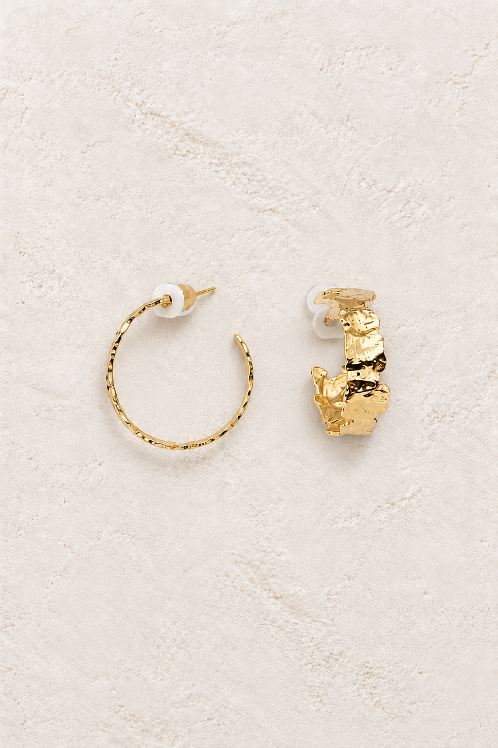 Kaia Hoop Earrings on warm ivory textured background