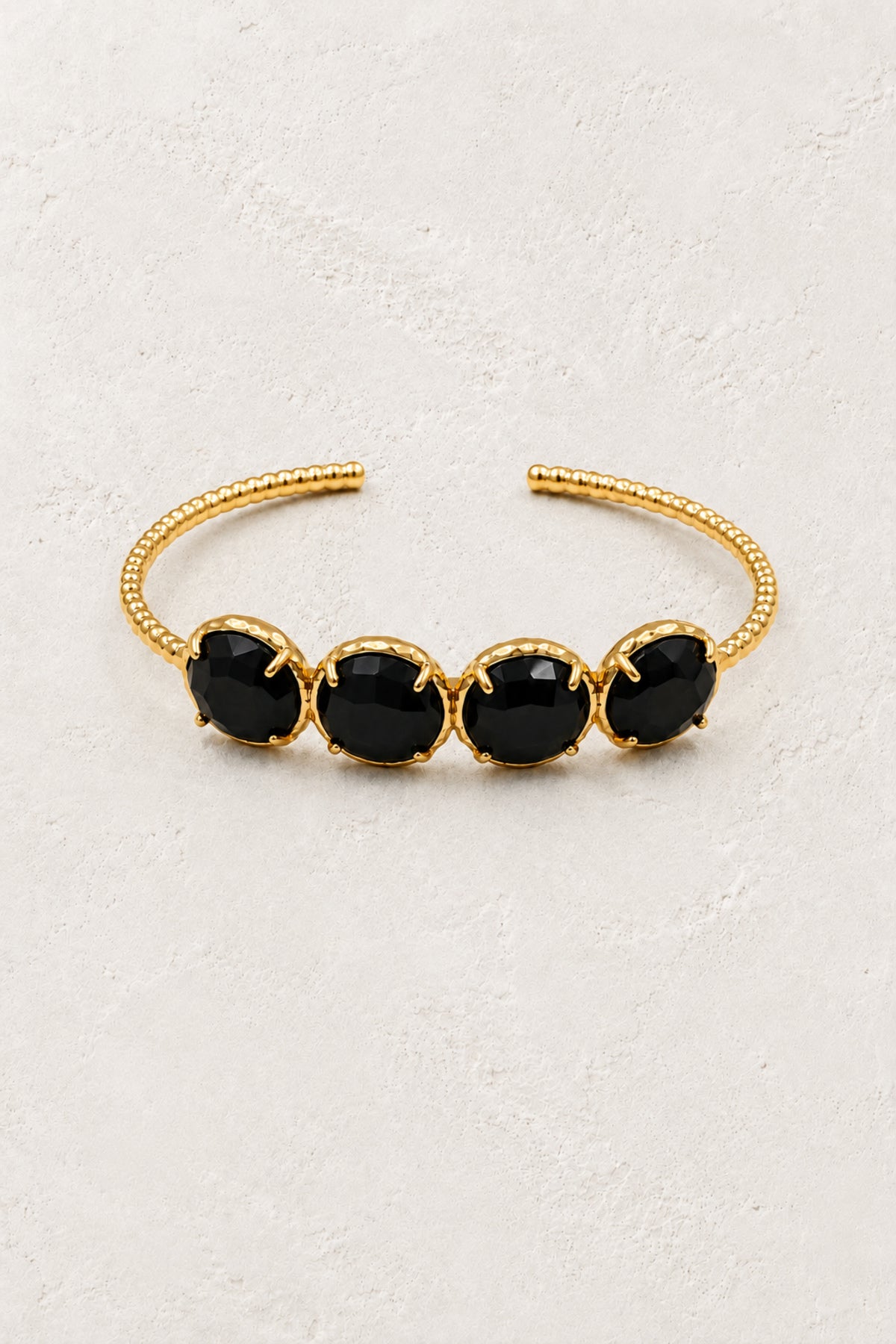 Black Obsidian Laguna cuff bracelet on ivory plaster
