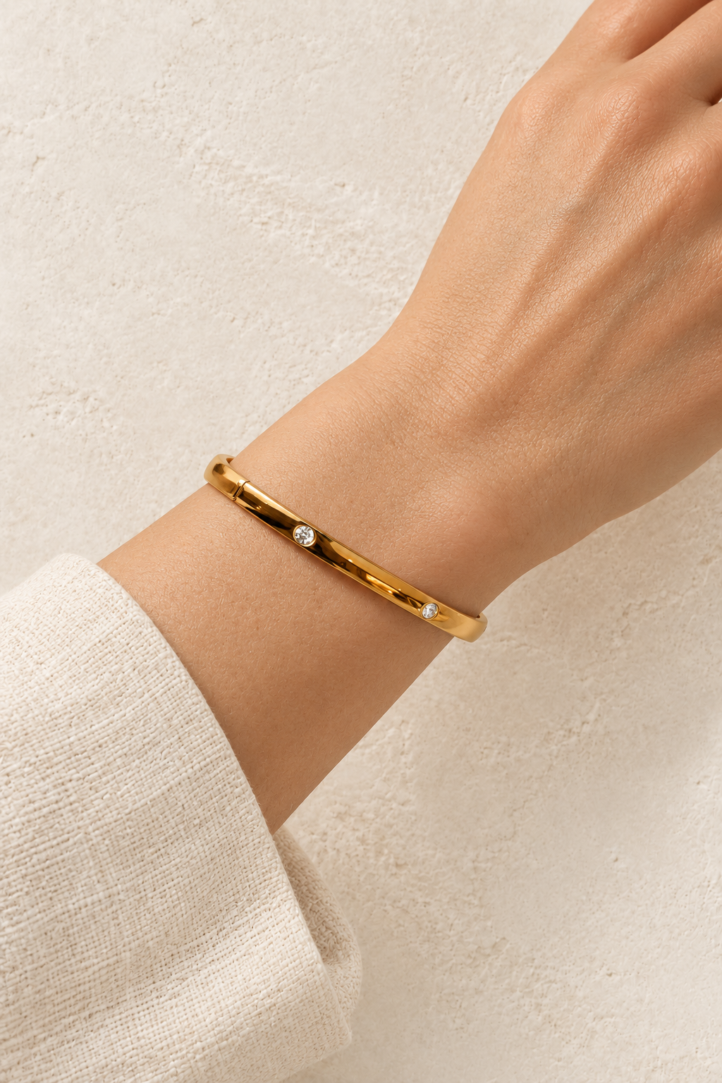 Model wearing Lola Gold Stud Bangle