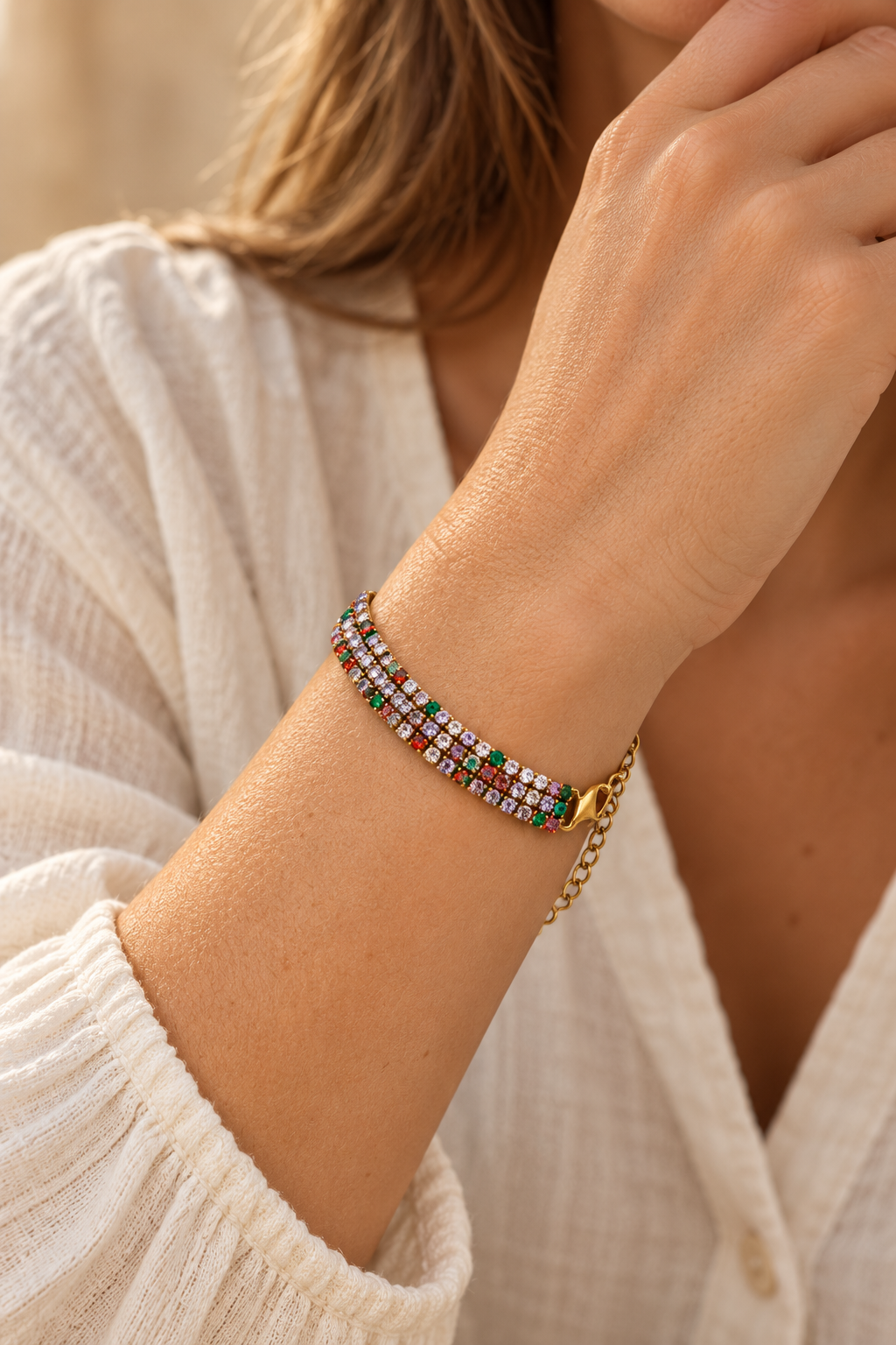 
                  
                    Luciana Gold Triple Row Multicolour Tennis Bracelet worn on a model's wrist
                  
                
